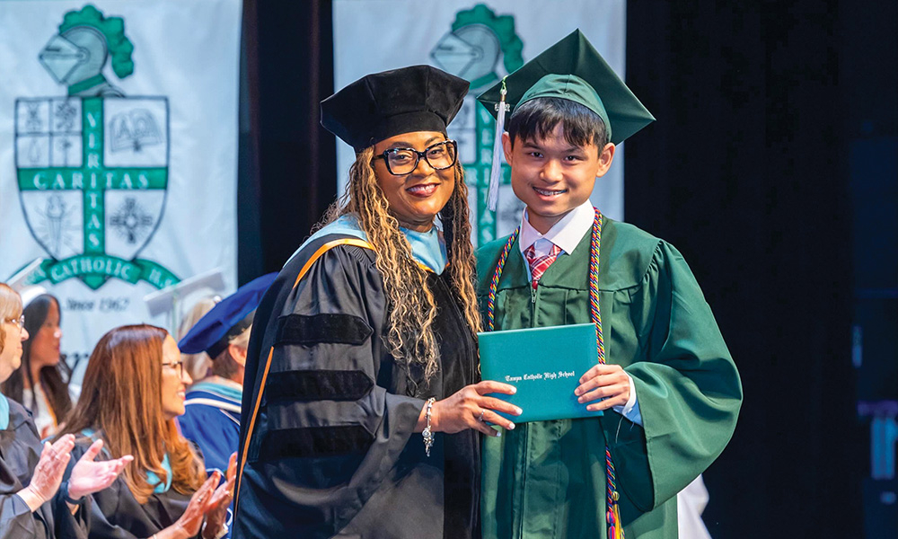 Student receiving diploma at graduation