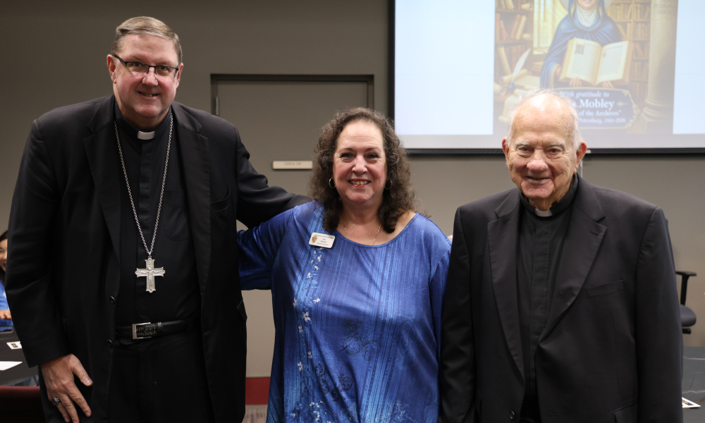 Lisa Mobley with Bishop Gregory Parkes and Bishop Emeritus Robert Lynch.