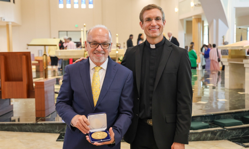 Father Anthony Astrab and Sammy Negron, the recipient of the St. Jude the Apostle Medal from Our Lady of Perpetual Help Parish in Tampa. | Photo by Allison Munden.