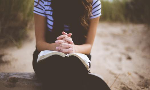 praying with book