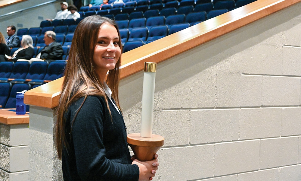 Miranda Steele holding candle