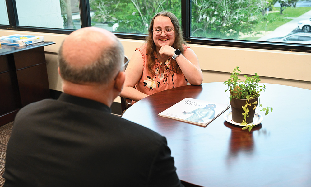 Brittany DeHaan talking to her spiritual director